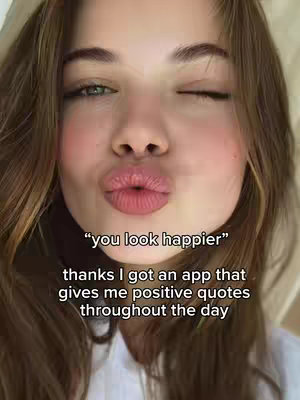 A close-up of a woman with long brown hair. Her lips are puckered in a kiss. Text overlays the image.