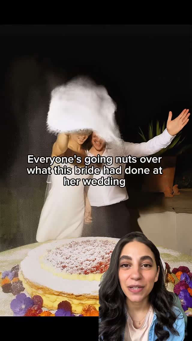 The cover image shows a split-screen: on the top half, there's a blurry shot of a man and a bride standing beneath a cloud of something white, possibly flour or dust. The bride is in a wedding dress, and the man is wearing a white shirt, with one arm raised. The bottom half of the image features a woman looking directly at the camera, speaking in front of a blurred cake.