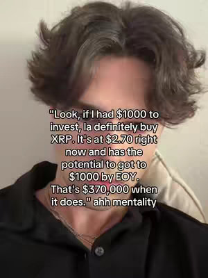 A selfie-style shot. In the foreground, the face and upper chest of a person with light skin and dark, wavy hair are visible. The person has a neutral expression. The background is blurred, with indistinct patches of a lighter color. There is text overlayed.
