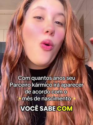 A selfie-style shot with a woman at the center, her face angled slightly to the side. The background is blurred, but appears to be a domestic setting. The woman has long, reddish-brown hair and is wearing a dark top. Text overlays at the bottom of the frame, in a sans-serif font, with two lines of questions. The overall color palette is warm, with the woman's skin tone and hair dominating.