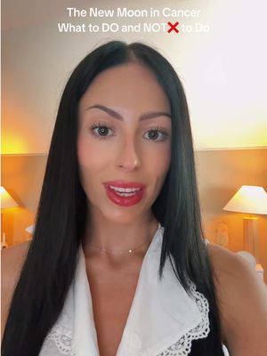 The cover features a woman looking directly at the camera, likely in a well-lit interior. Above her, text reads, "The New Moon in Cancer What to DO and NOT to Do."  The woman has long, dark hair and is wearing a white top. The background is somewhat blurred, and includes soft lighting, potentially from lamps.