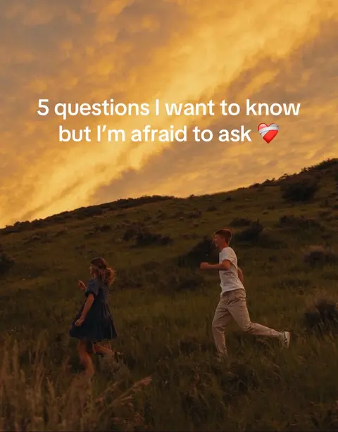 The cover image shows a couple running up a grassy hill at sunset. The sky is a warm blend of orange and yellow. Text overlaid states, "5 questions I want to know but I'm afraid to ask". A red heart graphic is adjacent to the text.