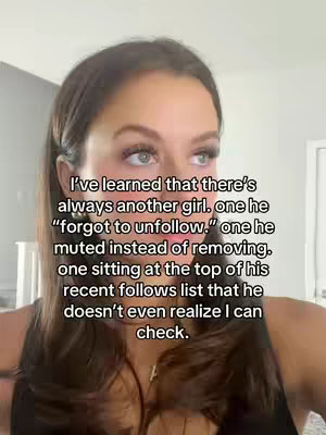 A woman with brown hair and a dark top is shown in a selfie style shot. Text overlays describe relationship issues.