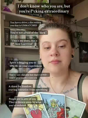 A person with fair skin and dark hair is the focal point of the shot, positioned slightly off-center. They are holding three tarot cards in their lower chest region. Several text elements, overlayed on the main subject, are highlighted with a vibrant color palette. Behind the person, a shelf offers a muted backdrop. The person looks directly at the camera, engaging the audience in a personalized manner.