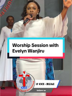 A woman in a white dress is holding a microphone and singing. Text is overlayed in a blue and red rectangle that says "Worship Session with Evelyn Wanjiru". In the bottom corner is a logo for Christian Church International. In the background are other people, presumably also singing.