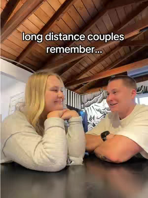 A cover image showing a couple at a table, smiling at each other. Above them is a wooden ceiling.