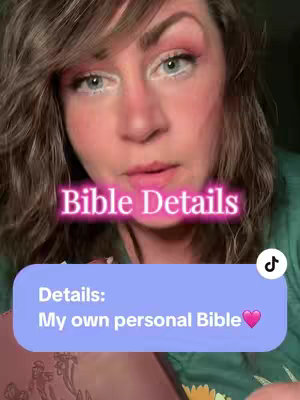 A woman with fair skin and blue eyes looks towards the camera, her face framed by dark hair. A neon pink text overlay in the image says 'Bible Details.' Below, a light blue banner contains the text 'Details: My own personal Bible', along with a pink heart emoji.