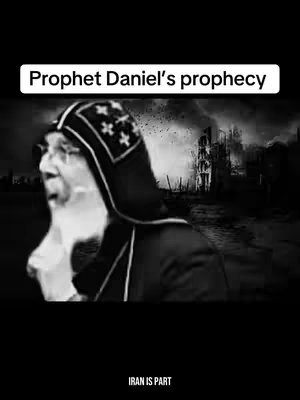 A black and white image featuring a man with a long white beard and traditional headwear, speaking with evident emotion. The background suggests a war-torn landscape with ruined buildings and a dark, ominous atmosphere. A white banner at the top reads \"Prophet Daniel's prophecy\". The bottom has the text \"IRAN IS PART\".