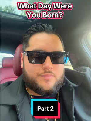 The image shows a man wearing sunglasses and a black jacket, sitting inside a car. Overlayed text asks, "What Day Were You Born?" The bottom of the image has a colored rectangle with the text "Part 2".