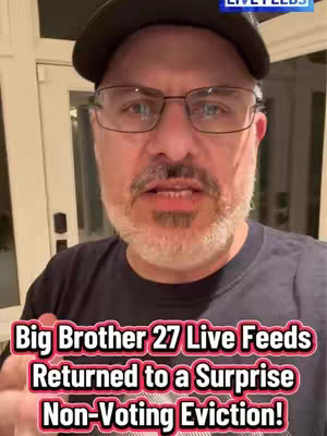 A middle-aged man with glasses and a goatee is the focal point of a selfie video. He's wearing a black t-shirt and a dark baseball cap, set against a background of what appears to be a home interior. The text 'LIVE FEEDS' is in the top right corner. A large text overlay at the bottom of the image features the text: 'Big Brother 27 Live Feeds Returned to a Surprise Non-Voting Eviction!'