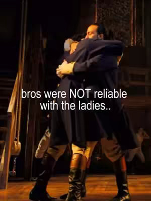 The image shows two men in period clothing embracing on a stage. The lighting is warm, and the overall composition is theatrical. Text overlays are added near the top, in the center that provide context for the video.