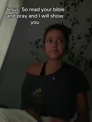 A young woman is centered in the frame, her expression neutral. Text overlay, seemingly like a quote is displayed.