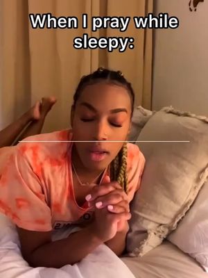 A person lying on a bed with their hands clasped in prayer, eyes closed, with text overlaid. The lighting is soft, suggesting a bedroom setting, and the color palette is warm and inviting.