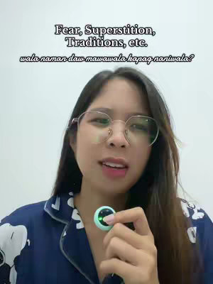 The cover image features a young woman with long dark hair and glasses, wearing a patterned pajama top. She is holding a small, round, green device near her neck, possibly a microphone. The background is a plain white wall. Text overlays are present at the top of the image.