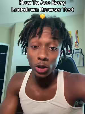 A young man with dreadlocks and a white tank top looks directly at the camera, with text overlayed at the top. He is in a room, with some items in the background, with the text in the video implying that he is teaching how to pass online tests.