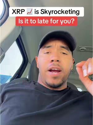 A man with a black cap and shirt is in the driver's seat of a car, looking directly at the camera. The image has a text overlay: "XRP is Skyrocketing Is it too late for you?"