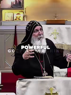 A medium shot of a man in religious attire, addressing the viewer. He is wearing a black robe with a hood and a patterned hat. His face is visible, showing a long white beard. The text overlay has the words 'POWERFUL GOSPEL PREACHING'.