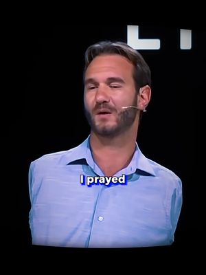 The image is a medium shot of a man with short brown hair and a beard, set against a black background. He's wearing a light blue collared shirt, and a small microphone is visible near his mouth. A text overlay at the bottom reads "I prayed" in a white font with a blue outline.