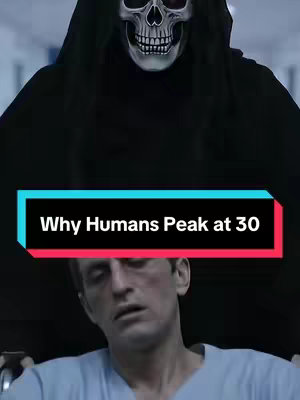 A person in a blue shirt is seated in a wheelchair, looking up with a distressed expression. Behind him, a grim reaper figure with a skull mask and black hooded cloak is visible. The foreground features a text box with the words 'Why Humans Peak at 30'. The color palette is dark, and the image has a slightly blurred quality.