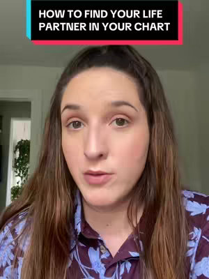 A woman with long brown hair is looking directly at the camera. The background is blurred, but suggests a brightly lit interior. A text overlay at the top reads: 'HOW TO FIND YOUR LIFE PARTNER IN YOUR CHART,' in a white font against a black and red background.