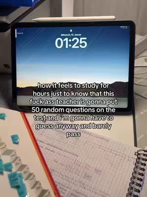 The image shows a close-up of an iPad displaying a screen with time, a sunset and skyline image, and a humorous text overlay. Next to the iPad, a set of study notes and a pen are visible.