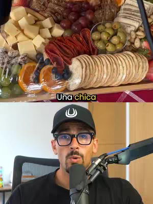 The cover image is split into two parts. The top half shows a charcuterie board with various food items such as cheese, grapes, olives, and bread. The bottom half features a man wearing a hat and glasses, speaking into a microphone.
