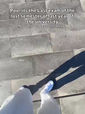 An overhead shot on a stone walkway shows the feet of the person, clad in white pants and white sneakers, walking forward.  Text overlays are present.