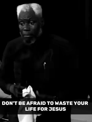 A grayscale photo features a man with gray hair and a dark outfit standing against a dark background. Text at the bottom urges viewers "DON'T BE AFRAID TO WASTE YOUR LIFE FOR JESUS."