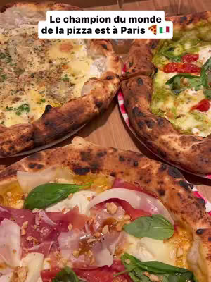 A close-up shot of several pizzas with different toppings. The pizzas are presented on a wooden surface. The text overlay tells where to get the world's best pizza. The arrangement of pizza in the image creates visual appeal, with a focus on the food.
