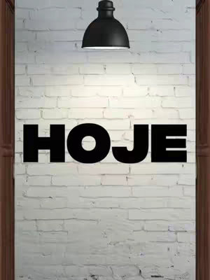 The cover image features a white brick wall background with large, bold text reading 'HOJE' in black, centered horizontally. Above the text, a black light fixture is positioned towards the top of the frame. The composition is simple, with the word 'HOJE' prominently displayed, and the lighting suggesting a focused spotlight.