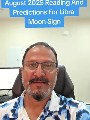 A man with glasses, a goatee, and a patterned shirt is centered in the frame. Above him, a light blue banner displays text about a Libra Moon Sign reading for August 2025. The background includes a wall, a white board, and the back of a chair.