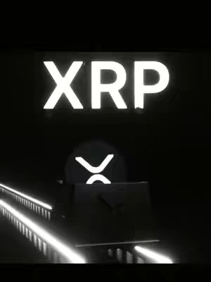 A dark image featuring the text "XRP" in large, glowing white letters at the top. Below, a stylized train car made of dark shapes and lights is seen on a track of white lines in perspective. The XRP logo is present within the train car, which is designed to look like a futuristic train. The overall image uses high-contrast lighting and dark colors for a sleek and modern aesthetic.