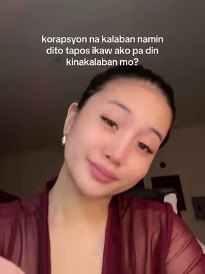 A close-up shot of a woman looking at the camera with a semi-smile, wearing a reddish-brown sheer robe. Text overlay is at the top.