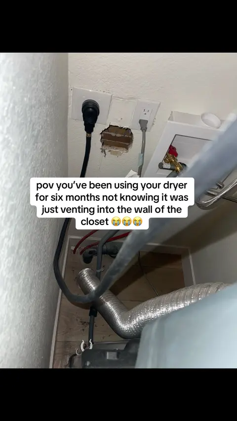 An image of a wall with an electrical outlet, a broken section revealing the interior materials, and a dryer hose. A text overlay states how the dryer was venting into the wall instead of outside.