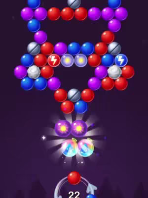 The cover image shows a mobile game interface with various colorful bubbles arranged to look like a star or arrowhead shape at the top. Below, appears two glowing orbs, above the user's next bubble, represented by a red orb in a targeting circle, and numbers. The background is a gradient of dark purples.