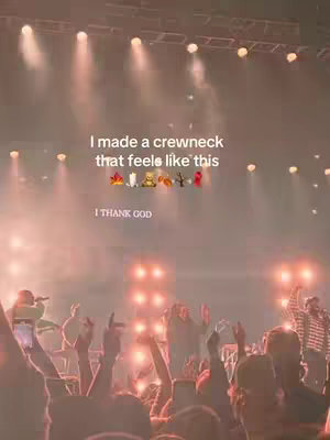 The cover image shows a crowd at a concert, with stage lights at the top and the crowd below. Overlay text shows 'I made a crewneck that feels like this' followed by a set of  emojis. Below these there is text that reads 'I THANK GOD'.