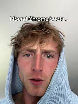 An individual with light skin and brown hair is the focus, viewed from the mid-chest up. They're wearing a light blue knitted hoodie, which frames their face. The background is a plain, light-colored wall. The individual's expression appears somewhat surprised or bewildered, with their mouth slightly open. Above the head is text overlay with the message.