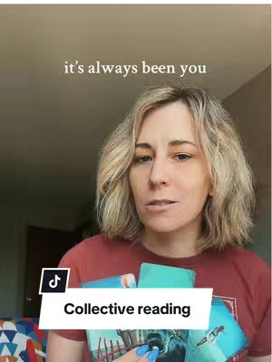 A woman with blonde hair is holding tarot cards in front of her chest. The background is a tan wall with a window. The text overlay at the top says "it's always been you", and a banner overlay has the text "Collective Reading".
