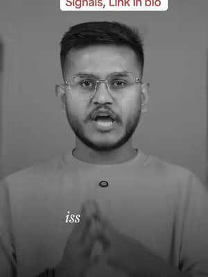 A monochrome portrait of a man with glasses, centered and facing the camera. The man has short dark hair and a trimmed beard. He is wearing a light-colored shirt. Above his head, is the text 'Signals, Link in bio'.