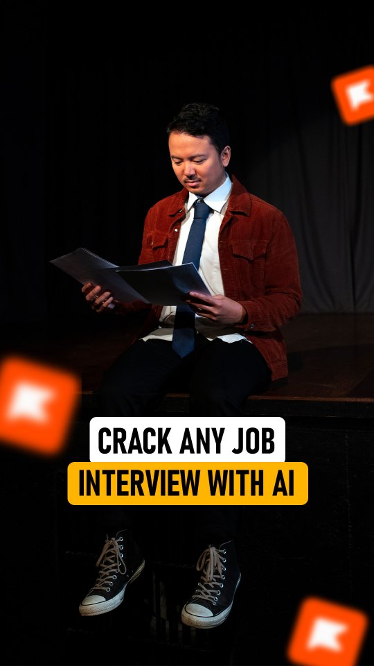 The cover image shows a man dressed in a red corduroy jacket and a white shirt with a blue tie, reviewing two sheets of paper. He is sitting, with his head tilted down, appearing focused. Overlayed on the image is text that reads, 'CRACK ANY JOB INTERVIEW WITH AI' and a yellow box behind the main text. The background is a dark, possibly theatrical, setting with a few orange logos floating in the background.