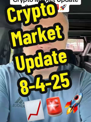A selfie-style video cover with text overlay. The main subject is a person with grey hair, wearing a light blue t-shirt. Behind them is a vehicle interior. Overlaid on the image are the words 'Crypto Market Update' above the date '8-4-25' in a bold yellow font. In the image, there are also graphics representing a rising graph, a flashing alarm, and a rocket.