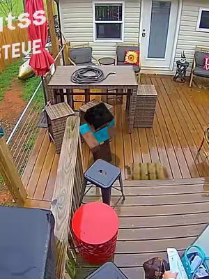 An overhead shot of a deck with a Minecraft Steve character in the middle. The deck is wet, and there are chairs, a table with a hose, and a red trash can in the shot. Text is overlayed on the left.