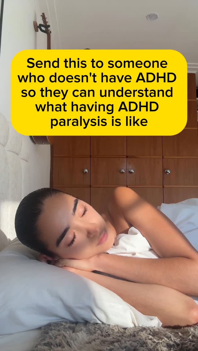 A woman lies on a bed, eyes closed, head on a pillow. A yellow rectangle overlay contains text, and a wooden cabinet is in the background.