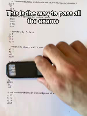 A hand holds a black object with a magnifying glass over a test paper, showing math questions. The overlay text states it's "This is the way to pass all the exams".