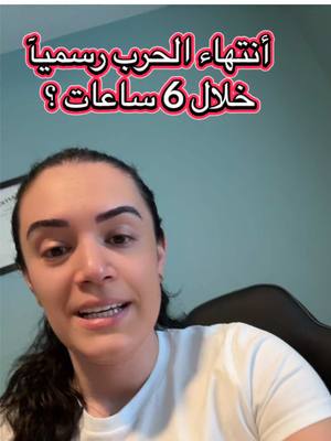 A woman with dark hair and a white t-shirt is centered in a video frame. Text in a pink and white bubble is superimposed above her head. The background is a teal-colored solid wall.