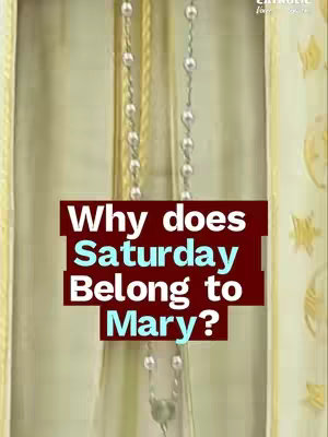 A vertical image shows a gold-colored curtain in the background and a beaded rosary in the foreground. Overlaying the backdrop is a maroon rectangle with white text stating 'Why does Saturday Belong to Mary?' The Catholic for Life logo is in the top right corner.