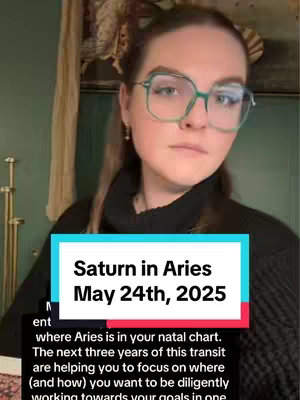 A young woman with glasses poses in front of an indistinct background. A rectangular text overlay at the bottom of the frame presents the title and key date.
