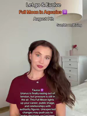 A woman with long brown hair and a maroon shirt is centered in the frame, with text overlays surrounding her. The background is a room with a lamp, a white cabinet, and part of a bed.