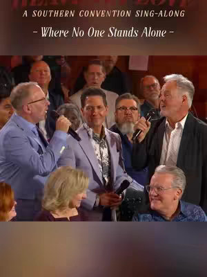 The cover image features a group of men singing in a large hall. The singers are wearing suits and holding microphones. Text overlays at the top indicate the title of the event and the song being performed.