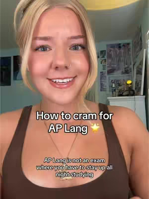 A selfie-style video with a young fair-skinned woman with blonde hair. She is smiling with text overlays. The lighting is bright, suggestive of a well-lit indoor space.